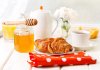 depositphotos_69575723-stock-photo-breakfast-with-croissants-honey-and.jpg