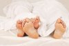 9862195-the-feet-of-a-couple-in-bed.jpg